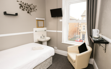 Single room with shared bathroom